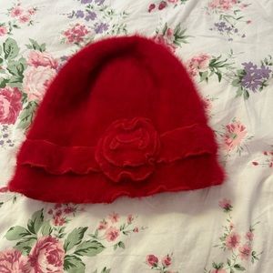 cute red hat with a flower accent